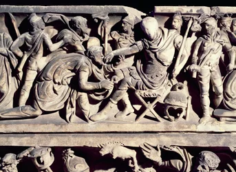 Relief from a sarcophagus depicting the submission of a barbarian to a Roman general